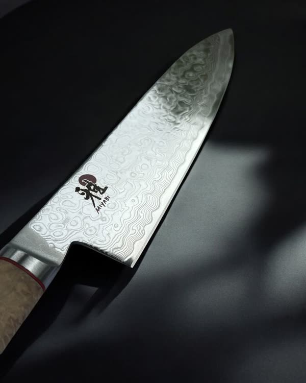 Close-up of a Damascus-patterned Japanese blade